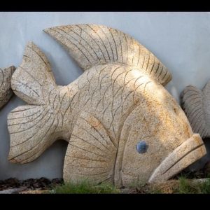 tallado de piedra concha pescado